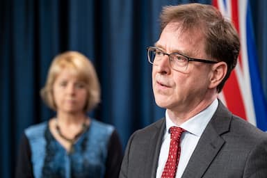 british-columbias-health-minister-celebrating-a-judges-decision-against-a-surgeon