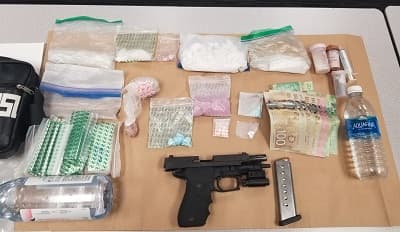 loaded-firearm-and-drugs-seized-from-man-and-woman-during-arrest